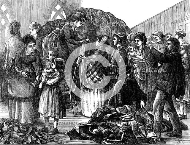 The Chicago Fire: Ladies of Chicago supplying the refugees with clothing, 1871. Creator: Unknown.