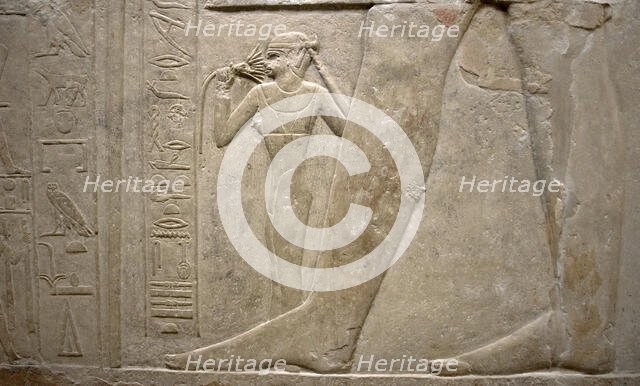 Relief of legs of Mereruka with his wife Watetkhethor..., Mastaba of Mereruka, Egypt, 2003.   Creator: Unknown.