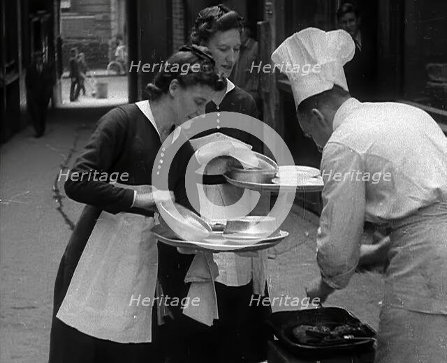 People Preparing Food, 1941. Creator: British Pathe Ltd.