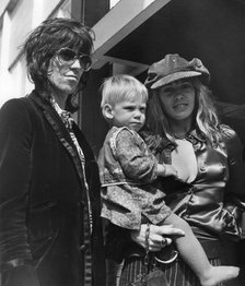 Keith Richards and Anita Pallenberg with baby Marlon, Heathrow, London, 1970. Artist: Unknown