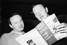 Humphrey Lyttleton and Alex Welsh reading a copy of Down Beat magazine, 1963. Creator: Brian Foskett.