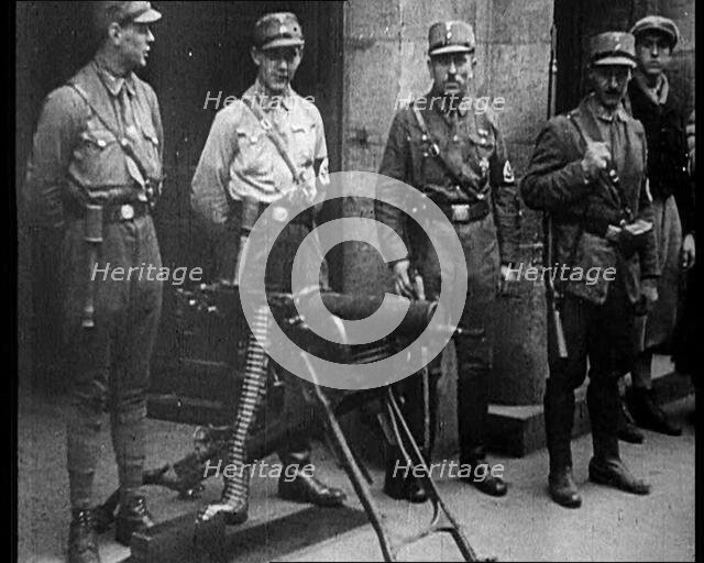 Uniformed Nazis Standing Next to a Machine Gun, 1933. Creator: British Pathe Ltd.