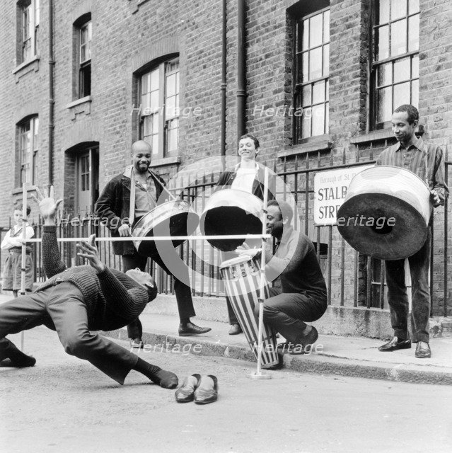 The Irwin Clement Caribbean steel band, possibly in Stalbridge Street, Marylebone, London, 1963. Creator: Henry Grant.