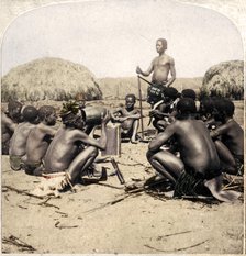 'Braves of a Zulu Village holding a Council, near the Umlaloose River, Zululand, S.A.', 1901. Artist: Unknown.
