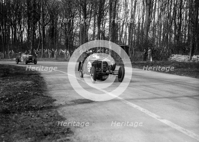 Frazer-Nash Byfleet II leading an MG at Donington Park, Leicestershire, 1935. Artist: Bill Brunell.
