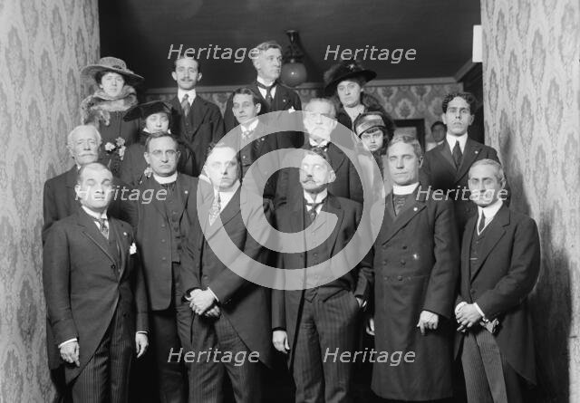 Unidentified Group On Entrance Stairway of John Barrett's Residence; 12 Men, 3 Women, Child, 1915.  Creator: Harris & Ewing.