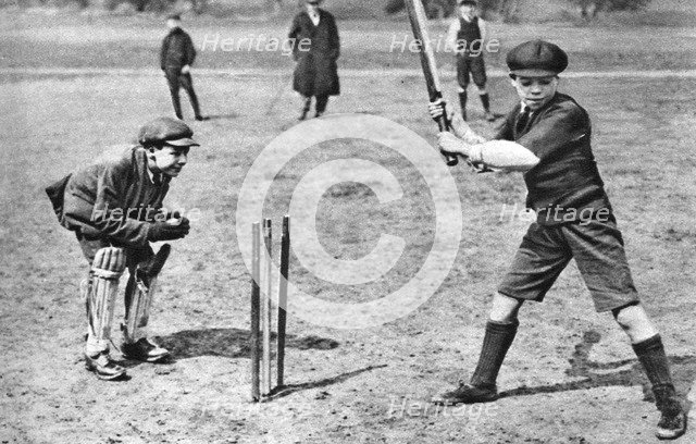 Boys playing cricket in Parliament Hill Fields, London, 1926-1927. Artist: Unknown