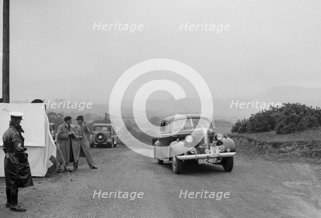 Pontiac saloon of J Owen-Smith competing in the South Wales Auto Club Welsh Rally, 1937 Artist: Bill Brunell.