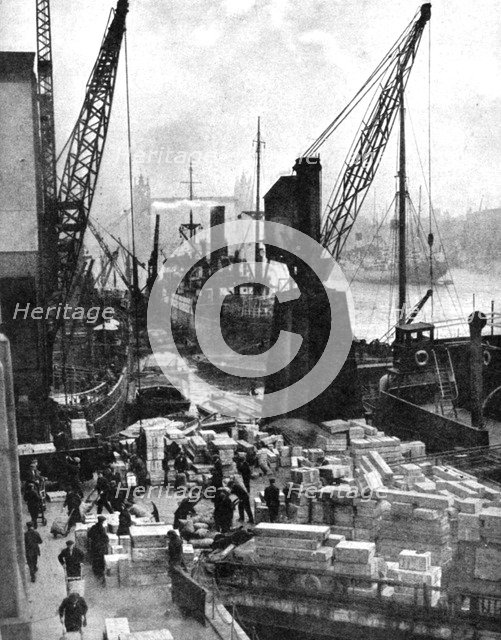 Cargo being unloaded at the docks, Upper Pool, London, 1936.Artist: Fox