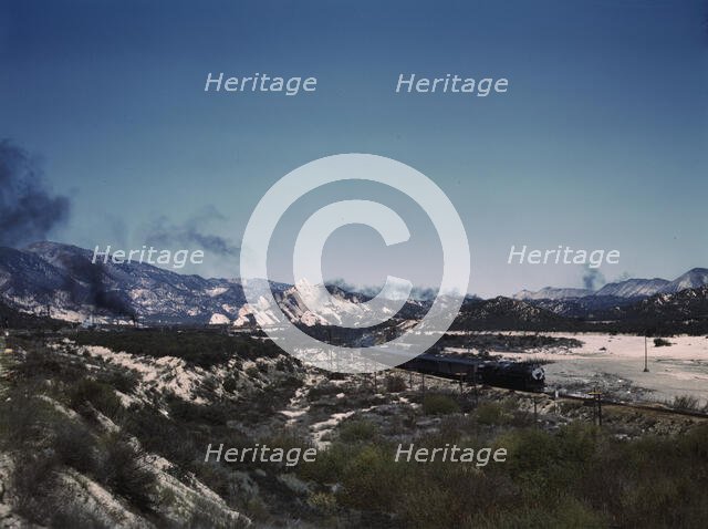 Santa Fe R.R. trains going through Cajon Pass in the San Bernardino Mountains, Cajon, Calif., 1943. Creator: Jack Delano.