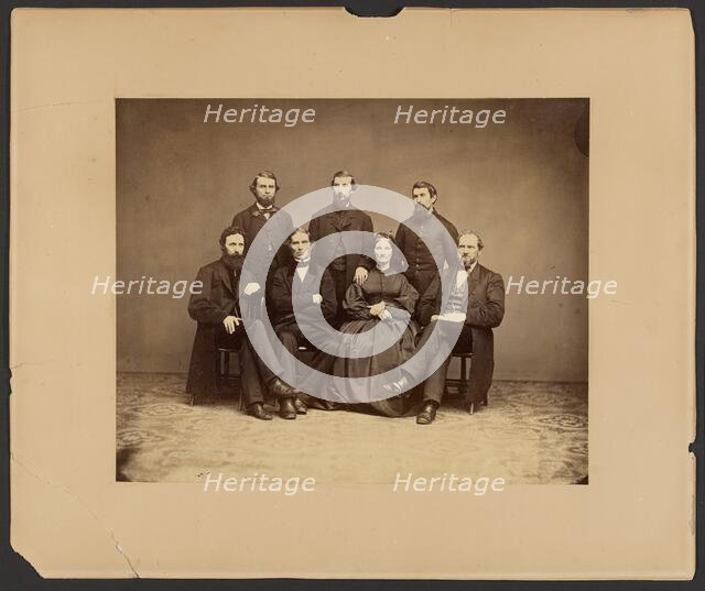 Group portrait of men and woman, about 1860-1869. Creator: Unknown.