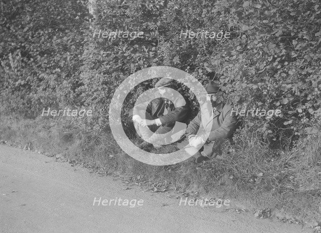 Two men taking a rest during the Bugatti Owners Club car treasure hunt, 25 October 1931. Artist: Bill Brunell.