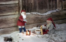 Christmas brownies getting their christmas porridge, 1960s. Artist: Göran Algård