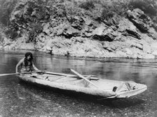Yurok canoe on Trinity River, c1923. Creator: Edward Sheriff Curtis.