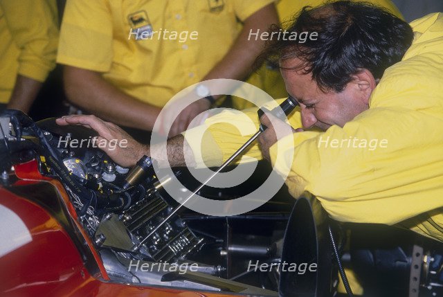 Mechanic at work in the Ferrari pits, 1988. Artist: Unknown