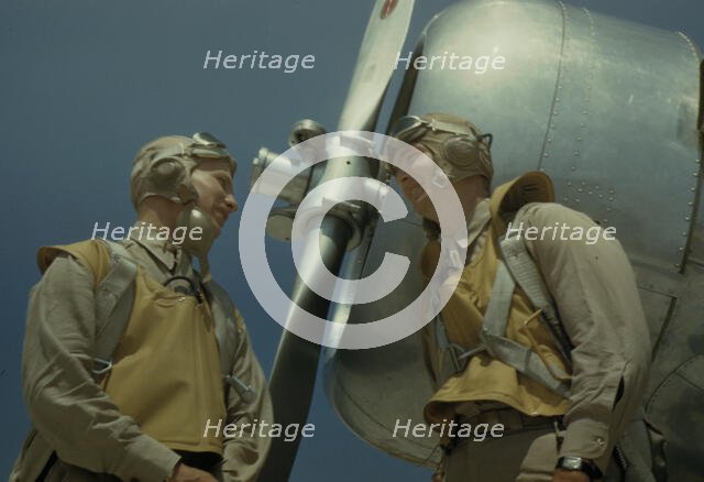 Marine lieutenants, pilots, by the power tow-plane...Parris Island's Page Field, S.C., 1942. Creator: Alfred T Palmer.