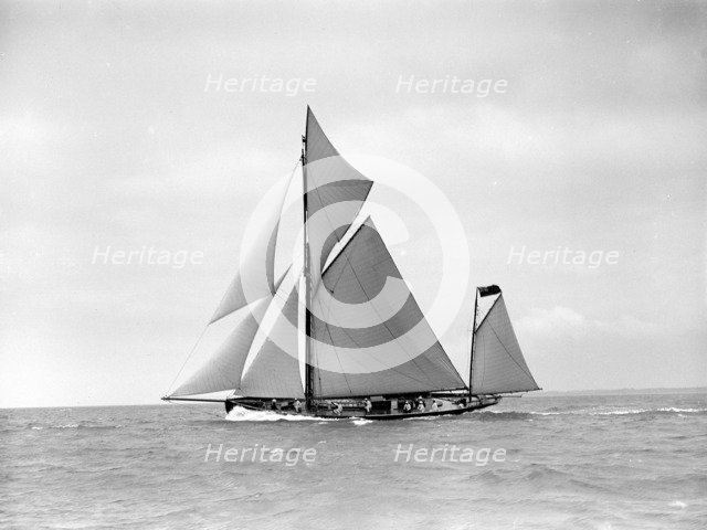 The yawl 'Joyce' sailing in good wind, 1911. Creator: Kirk & Sons of Cowes.