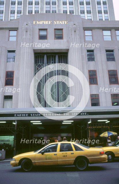 Cab outside Empire State Building New York. Artist: Unknown.