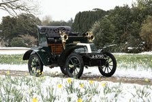 1904 De Dion Bouton model Q in snow with daffodils at Beaulieu. Creator: Unknown.