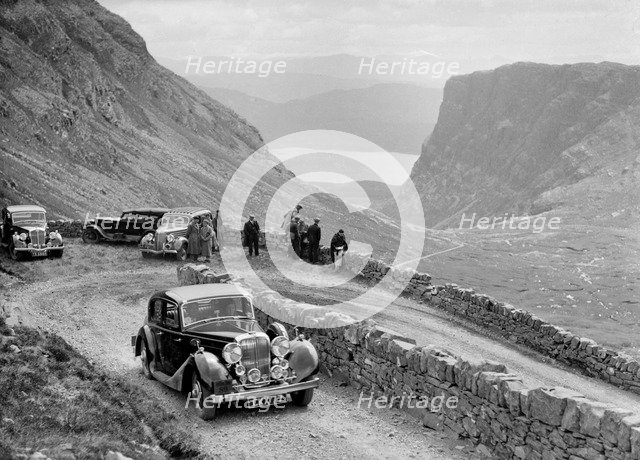 SS Jaguar saloon of DS Hand competing in the RSAC Scottish Rally, 1936. Artist: Bill Brunell.