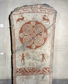 Memorial picture stone decorated with whorls symbolising the sun and vignettes from the hunt.