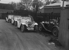 Three Singer cars and a MG PA at a motoring trial, 1930s. Artist: Bill Brunell.