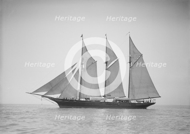 The three-mast auxiliary schooner 'Invincible', 1911. Creator: Kirk & Sons of Cowes.