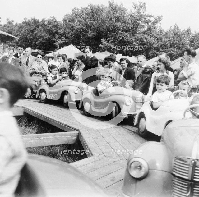 Children on a fairground ride, Festival of Britain, 1951. Artist: Henry Grant