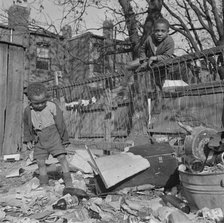 Two boys playing in their backyard, Washington (southwest section), D.C., 1942. Creator: Gordon Parks.