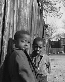 Two Negro boys, Washington (southwest section), D.C., 1942. Creator: Gordon Parks.