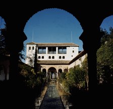 View of the courtyard of the ditch with the gardens and fountains of the Alhambra, at the bottom …