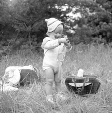A little girl has found the picnic basket, Sweden, 1955. Artist: Unknown