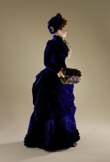 Woman's two-piece dress ensemble with matching hat, blue silk velvet., c.1880. Creator: Unknown.