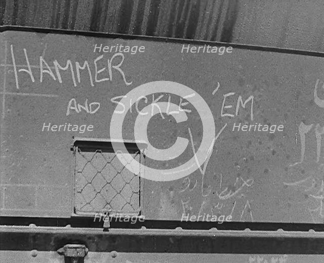 The Words: 'Hammer and Sickle ‘Em’ Written on Some Cargo, 1943. Creator: British Pathe Ltd.