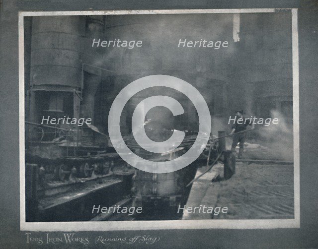 'Tees Iron Works - Running Off Slag', 1919. Artist: Hood & Co. Ltd.