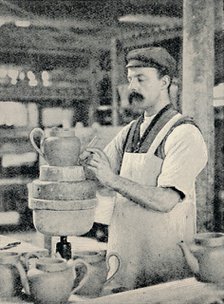 'Fixing Spout on a Teapot', c1917. Artist: Unknown.