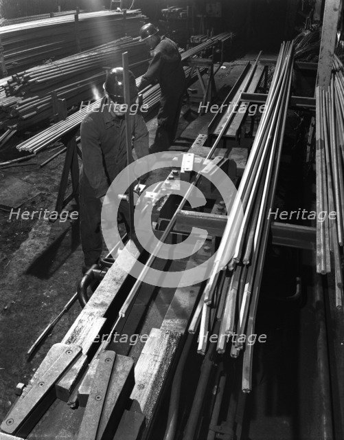 Drawing hexagonal rods, Edgar Allen Steel Foundry, Sheffield, 1962.  Artist: Michael Walters