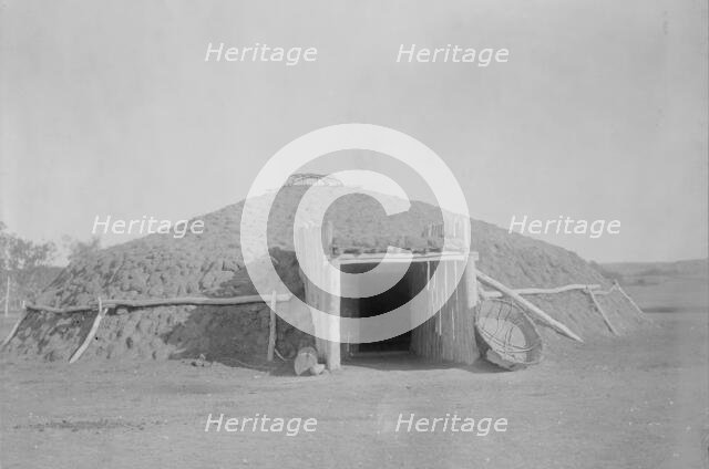 Mandan earthen lodge, c1908. Creator: Edward Sheriff Curtis.