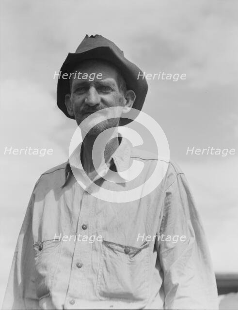 Ex-tenant farmer on relief grant in the Imperial Valley, California, 1937. Creator: Dorothea Lange.