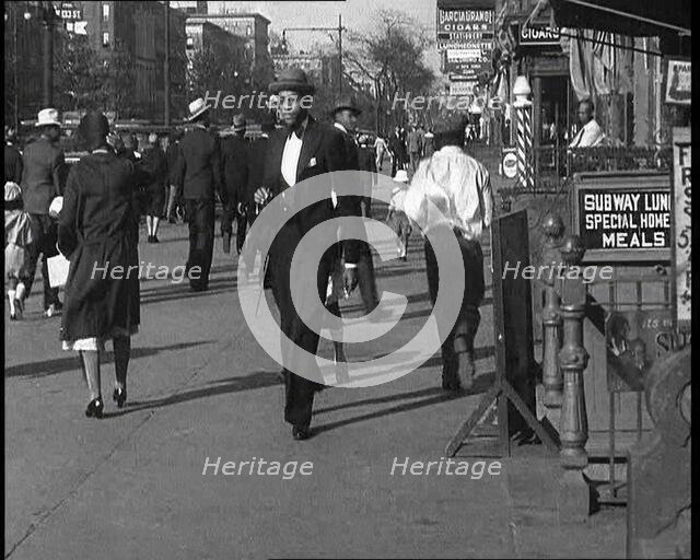 Smartly Dressed People Walking Along the Streets of New York City, 1932. Creator: British Pathe Ltd.