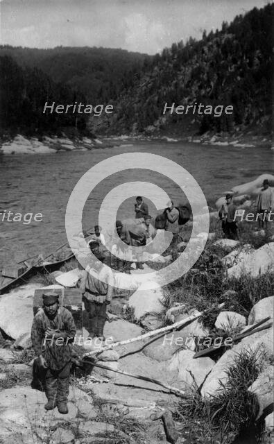 Unloading the Land-Management Expedition Boats, for Detouring the Mrassu River Rapid, 1913. Creator: GI Ivanov.