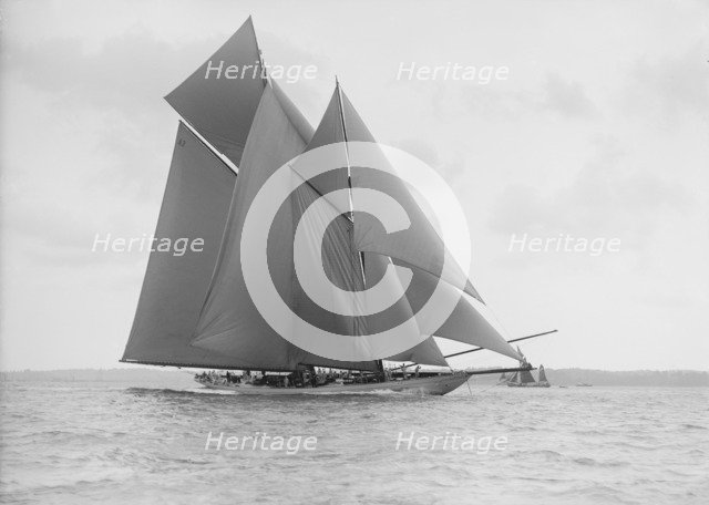 The 250 ton schooner 'Germania' sails on a reach, 1913. Creator: Kirk & Sons of Cowes.