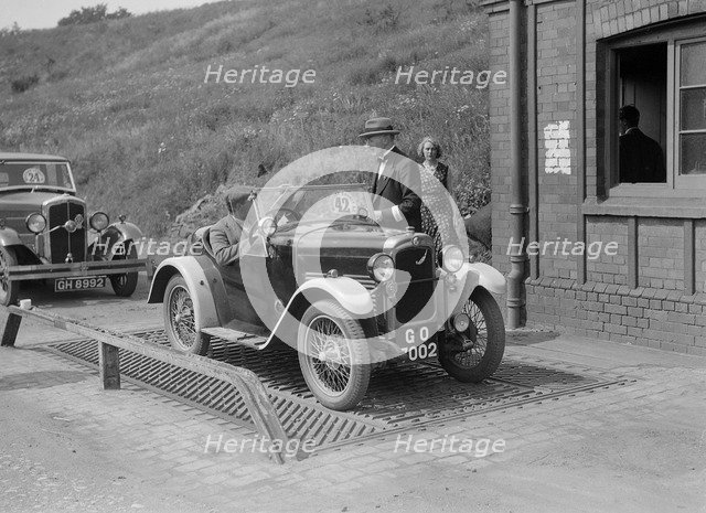 Triumph of J Wallis, winner of the Autocar Cup at the Middlesex County AC Hill Climb, c1930. Artist: Bill Brunell.