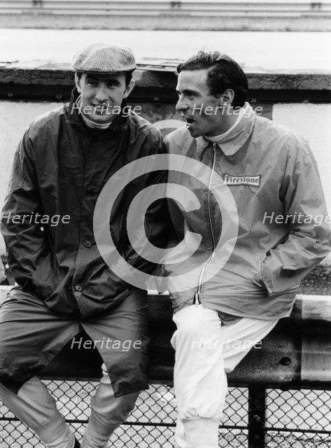 Jackie Stewart on the left, and Jim Clark, 1967. Artist: Unknown