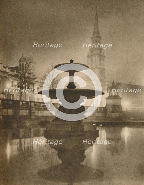 'Night Rain Has Turned The Pavements To A Pool of Reflections', c1935. Creator: Calkin.