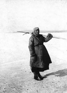An Angarsk peasant woman goes to check the ouds, 1911. Creator: Unknown.