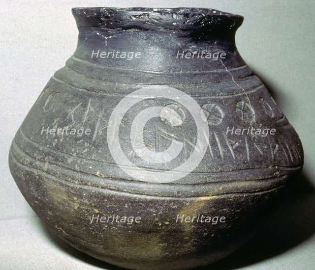 Pottery cremation urn, from a grave at Loveden Hill, Lincolnshire, Anglo-Saxon, 6th-7th century. Artist: Unknown