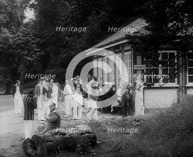 Cricket Players Relaxing Outside, 1940. Creator: British Pathe Ltd.