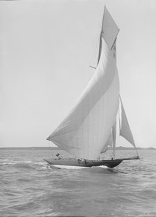 The 8 Metre 'Termagent' (H9) sailing downwind in fine weather, 1911. Creator: Kirk & Sons of Cowes.