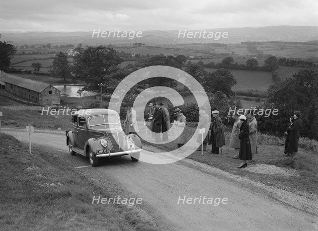 Ford V8 saloon of Viscountess Chetwynd competing in the South Wales Auto Club Welsh Rally, 1937 Artist: Bill Brunell.